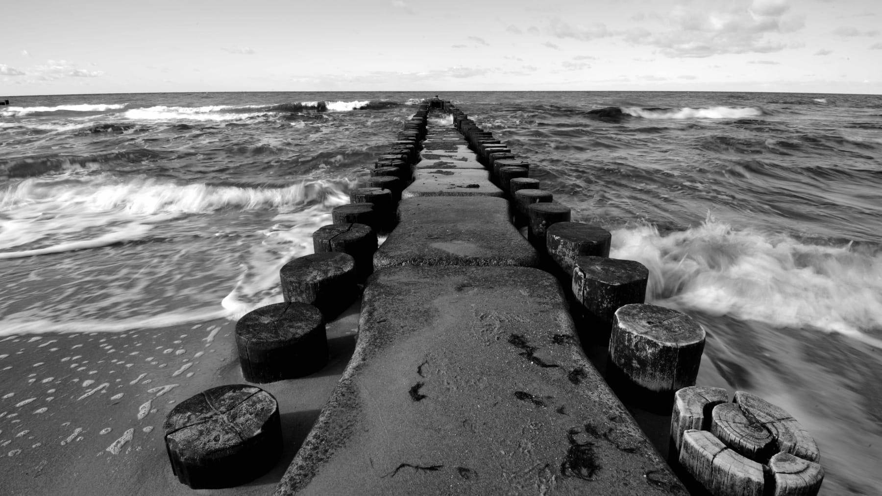 Open water moving against a line of groynes